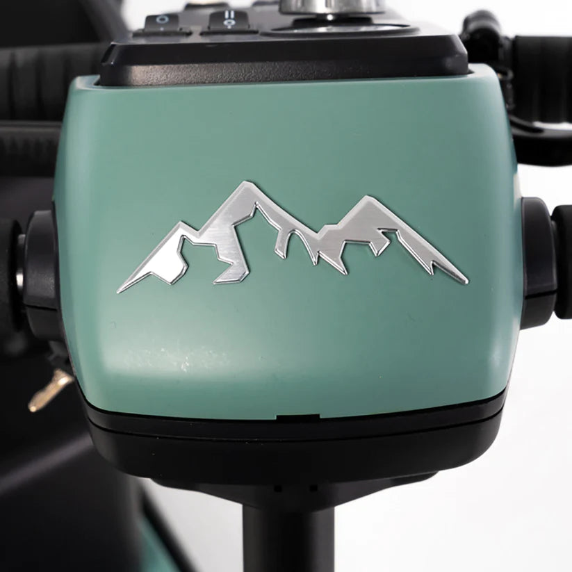 Close-up of the teal Pride Baja Bandit electric scooter motor with a silver mountain logo