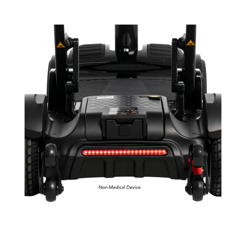Rear view of Pride Mobility Go Go Carbon wheelchair showing black frame and red lights