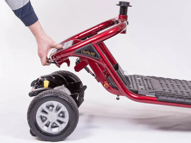Close-up of red LiteRider 4-Wheel Mobility Scooter frame and front wheel by Golden Technologies