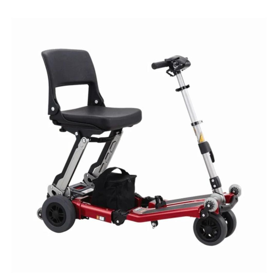 Free Rider USA Luggie Classic II portable red mobility scooter with black seat and handlebars