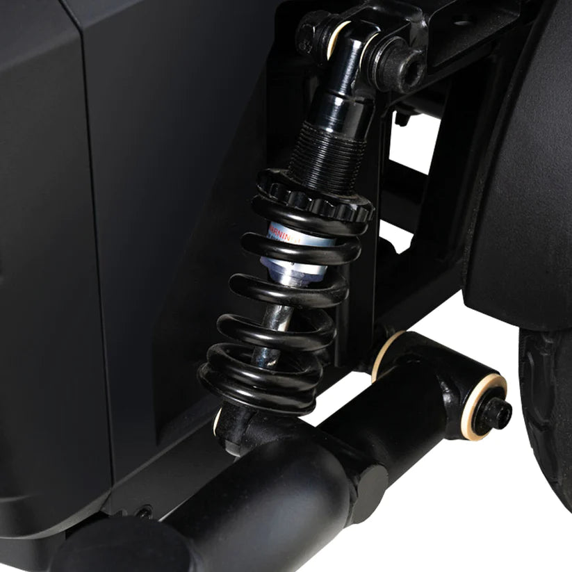 Close-up of suspension spring and shock absorber on Pride Jazzy EVO 614 Power Chair for smooth ride