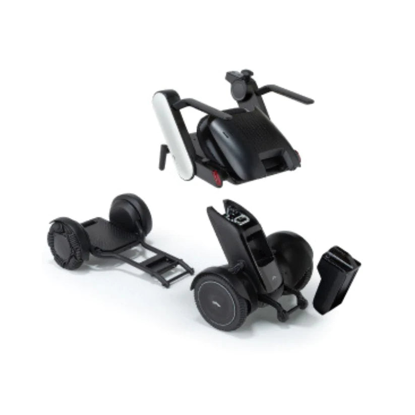 Disassembled WHILL Model C2 Smart Power Chair showing frame, seat, and battery components