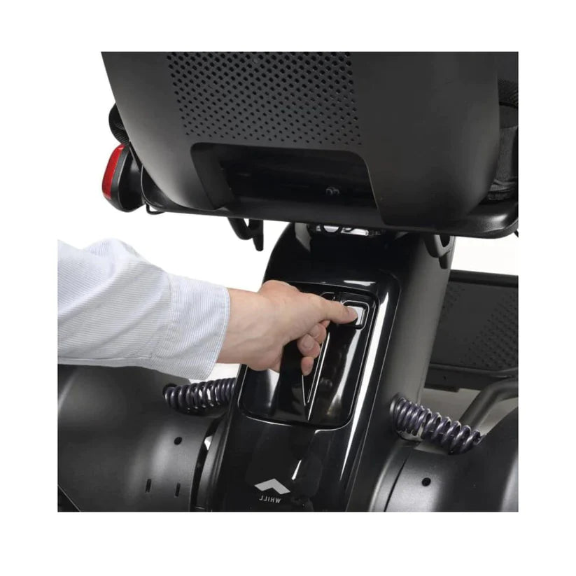 Close-up of hand operating the control panel on the WHILL Model C2 Smart Power Chair by Whill.inc